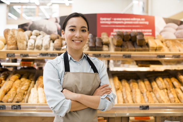smiling female supermarket staff